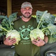 John holding two Superschmelz or Giant White Kohlrabi.
