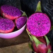 Sliced and whole freshly picked Edgar's Baby Dragon Fruit.