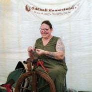 A woman spinning yarn at the Baker Creek Fall Harvest Festival.
