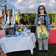 A vendor showing off her wares at the Baker Creek Fall Harvest Festival.