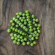 Little Marvel Garden Peas on wooden background.