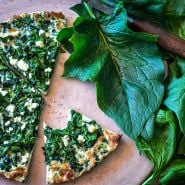Gigante d' Inverno Spinach on pizza stone with spinach and feta pizza.