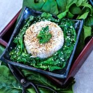 Jiromaru Spinach cooked with rice on bed of fresh leaves.
