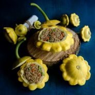 Stuffed Patisson Golden Marbre Scallop Summer Squash on a dark blue background.