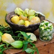 Chupon de Malinalco Tamarilloes in a wooden bowl surrounded by fruit on the vine and salsa.
