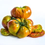 Large Ananas Noire or Black Pineapple Tomatoes with slices on a white background.