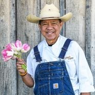 Chef Tong holding a posy of pink tulips at the Baker Creek Tulip Festival.