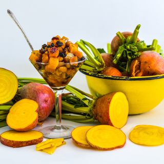 Cut and whole Golden Beets with Roasted Beet Salad and a bright yellow bowl of beets.