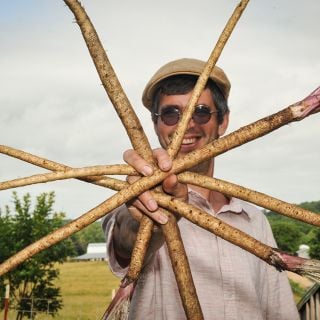 Jere Gettle holding arranged Takinogawa Burdock Root.