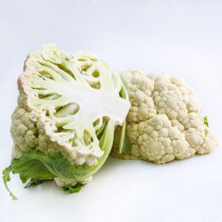 A head of Rober Cauliflower sliced in half on white background.