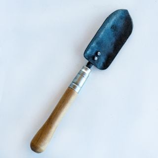 Frontside view of the hand-forged Long Handled Trowel against a white background.