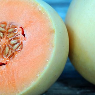Honeydew Orangeflesh halved.