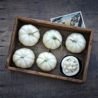 Kiku Melons in wooden tray.