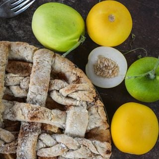 A pie made from Mango Melon or Vine Peach Melon surrounded by more melons.
   
