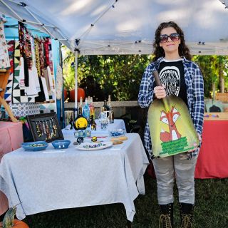 A vendor showing off her wares at the Baker Creek Fall Harvest Festival.