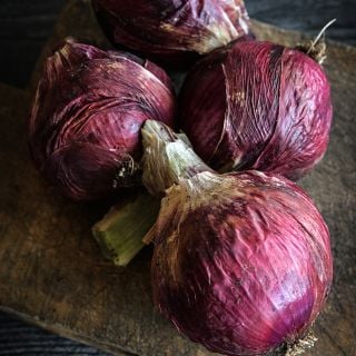 Round Tropea Onions in wrapper.