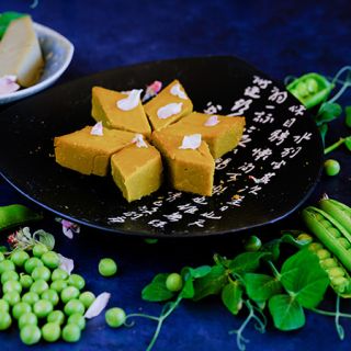 Lincoln Garden Pea with the Chinese pea pudding dessert on a dark blue background.            