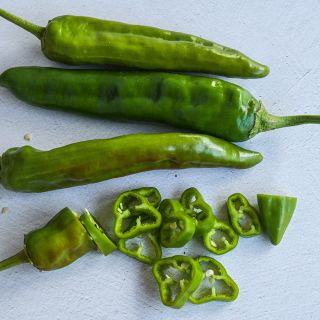Anaheim Peppers, whole and sliced.