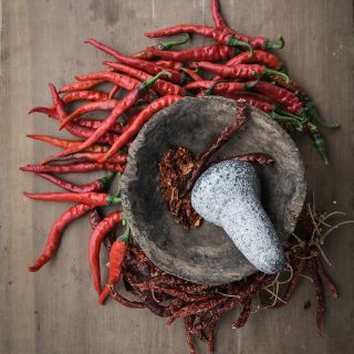 Cayenne Long Thin Peppers with mortar and pestle.