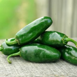 Craig's Grande Jalapeno stack on wooden table.