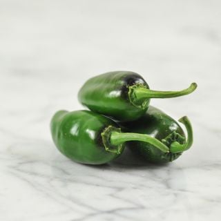 Craigs Grande Jalapeno trio on marble countertop.