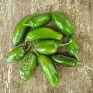 Craig's Grande Jalapeno on wooden table.