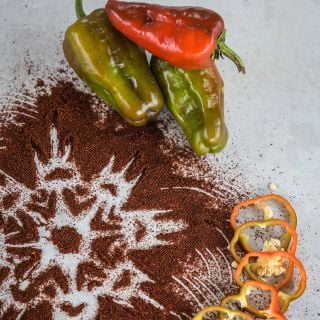 Leutschauer Paprika Pepper with slices and ground pepper with mandala design.