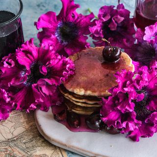 Cosmic Cherry Superbissima blooms topping pancakes with cherry syrup.