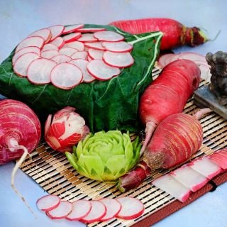 China Rose Radishes whole, carved like rose radishes and sliced.