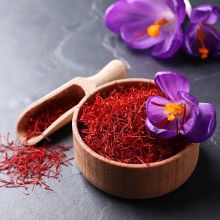 Saffron Crocus blooms with saffron harvested from the crocus. Image courtesy of Shutterstock.