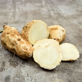 Jersey Yellow Sweet Potatoes on a wooden background.
