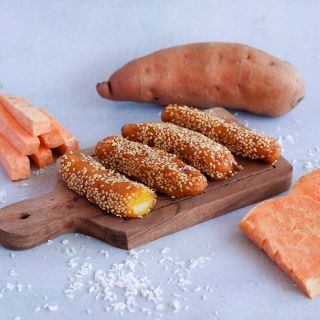 Pumpkin Yam Sweet Potatoes with a dessert recipe on a cutting board on a light background.