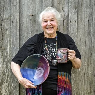 A pottery vendor showing her pottery at the Baker Creek Tulip Festival.