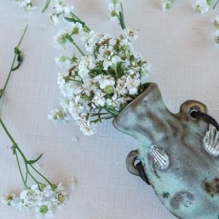 Double Diamond Pearl Yarrow bundle on fabric background.