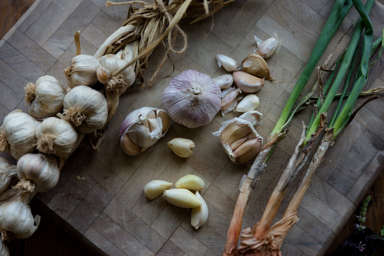 Garlic bulbs on a wooden board