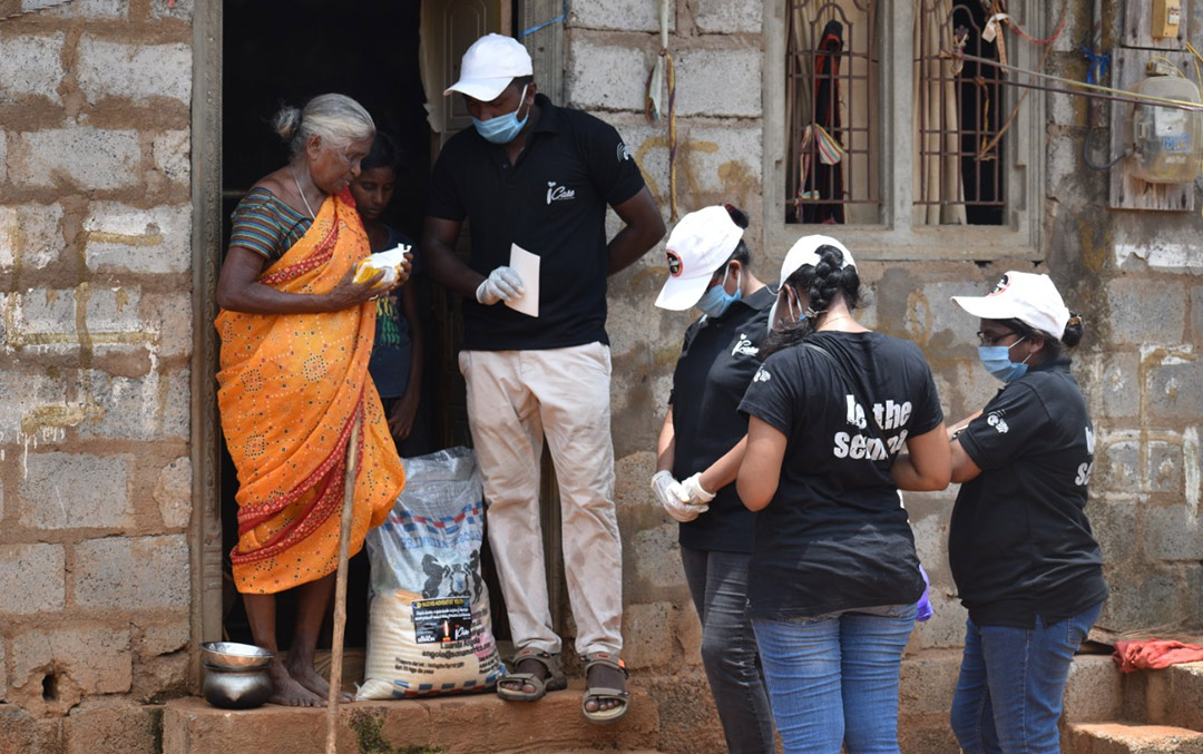 People in line for Covid relief in India. Image from ADRA