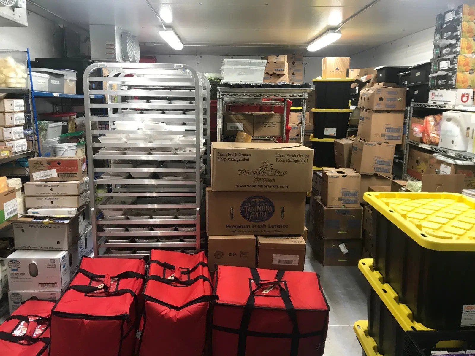 Food delivery containers in a storage room