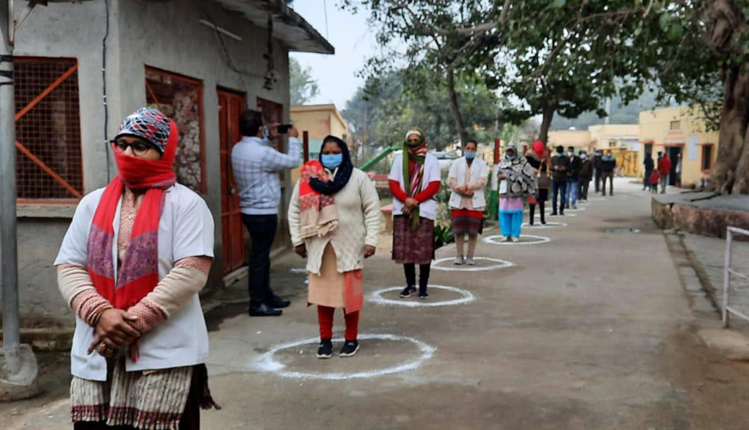 People in India waiting for covid help. Image courtesy of ADRA